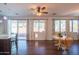 Kitchen with hardwood floors, an island, and access to the backyard at 17186 W Post Dr, Surprise, AZ 85388