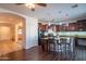 Island kitchen with granite countertops and stainless steel appliances at 17186 W Post Dr, Surprise, AZ 85388