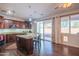 Modern kitchen with granite countertops and dark wood cabinets at 17186 W Post Dr, Surprise, AZ 85388