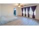 Large bedroom with walk-in closet and ceiling fan at 17186 W Post Dr, Surprise, AZ 85388