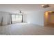 Spacious bedroom with light gray walls and wood-look flooring at 17186 W Post Dr, Surprise, AZ 85388