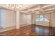 Spacious living room featuring hardwood floors and lots of natural light at 17186 W Post Dr, Surprise, AZ 85388