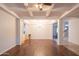 Bright dining room with hardwood floors and a modern chandelier at 17186 W Post Dr, Surprise, AZ 85388