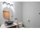 Modern bathroom with updated vanity, vessel sink, and toilet at 17186 W Post Dr, Surprise, AZ 85388