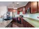 Modern kitchen with granite countertops and stainless steel appliances at 17186 W Post Dr, Surprise, AZ 85388