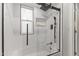 Clean and contemporary bathroom featuring a tub, shower, and herringbone tile at 10408 N 11Th St # 2, Phoenix, AZ 85020