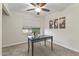 Bright bedroom with a ceiling fan, built-in shelving, and large window at 10408 N 11Th St # 2, Phoenix, AZ 85020