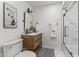 Modern bathroom with a walk-in shower, stylish vanity, and elegant fixtures at 10408 N 11Th St # 2, Phoenix, AZ 85020