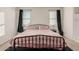 Bedroom with a queen bed and neutral colored bedding at 30009 W Monterey Dr, Buckeye, AZ 85396