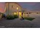 View of home's back exterior and backyard with basketball court at 30009 W Monterey Dr, Buckeye, AZ 85396