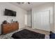 Bedroom with double bed, dresser and closet at 30009 W Monterey Dr, Buckeye, AZ 85396