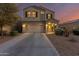 Two-story house with a two-car garage and desert landscaping at 30009 W Monterey Dr, Buckeye, AZ 85396