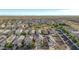 Aerial view of a house and neighborhood with solar panels at 30009 W Monterey Dr, Buckeye, AZ 85396