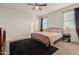 Spacious bedroom with a queen bed and ceiling fan at 30009 W Monterey Dr, Buckeye, AZ 85396