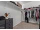 Large walk-in closet with ample shelving and hanging space at 30009 W Monterey Dr, Buckeye, AZ 85396