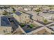 Aerial view of a house with a backyard, solar panels, and a basketball hoop at 30009 W Monterey Dr, Buckeye, AZ 85396