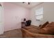 Bedroom with couch, desk and window seat at 30009 W Monterey Dr, Buckeye, AZ 85396