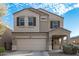 Two-story house with a two-car garage and desert landscaping at 30009 W Monterey Dr, Buckeye, AZ 85396
