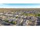 Aerial view of a neighborhood with many houses and solar panels at 30009 W Monterey Dr, Buckeye, AZ 85396