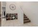 Entryway with staircase, shoe rack, and western-style decor at 30009 W Monterey Dr, Buckeye, AZ 85396