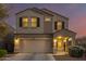 Two-story house with a two-car garage and desert landscaping at 30009 W Monterey Dr, Buckeye, AZ 85396