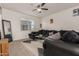Spacious living room featuring a large sectional sofa and a coffee table at 30009 W Monterey Dr, Buckeye, AZ 85396