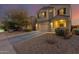 Two-story house with a two-car garage and desert landscaping at 30009 W Monterey Dr, Buckeye, AZ 85396