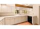 Well-equipped kitchen with white cabinets and tile flooring at 10044 E Graythorn Dr, Scottsdale, AZ 85262