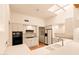 Bright kitchen boasts modern appliances and ample counter space at 10044 E Graythorn Dr, Scottsdale, AZ 85262