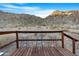 Deck with three metal stools and mountain views at 52320 W Foothill Trl, Maricopa, AZ 85139