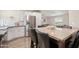 Eat-in kitchen with modern appliances and a spacious island at 52320 W Foothill Trl, Maricopa, AZ 85139