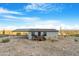 Single story home with carport and deck, mountain views at 52320 W Foothill Trl, Maricopa, AZ 85139