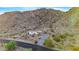Desert setting showcasing mobile home and mountain backdrop at 52320 W Foothill Trl, Maricopa, AZ 85139