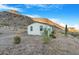 Mobile home with mountain backdrop and desert landscape at 52320 W Foothill Trl, Maricopa, AZ 85139