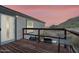 Wooden deck with seating, grill, and mountain views at 52320 W Foothill Trl, Maricopa, AZ 85139