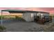 Single-wide manufactured home with covered parking and deck; scenic desert background at 52320 W Foothill Trl, Maricopa, AZ 85139