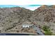 Single-story home nestled in desert mountain landscape at 52320 W Foothill Trl, Maricopa, AZ 85139