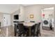 Kitchen with dining area and access to laundry facilities at 52320 W Foothill Trl, Maricopa, AZ 85139