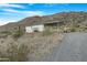 Mobile home with carport and desert landscape views at 52320 W Foothill Trl, Maricopa, AZ 85139