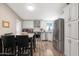 Updated kitchen with stainless steel appliances and white cabinets at 52320 W Foothill Trl, Maricopa, AZ 85139
