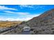 Mobile home nestled in mountain landscape with scenic views at 52320 W Foothill Trl, Maricopa, AZ 85139