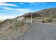 Single-wide manufactured home on a mountain lot at 52320 W Foothill Trl, Maricopa, AZ 85139