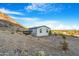 Single story home with deck, mountain backdrop at 52320 W Foothill Trl, Maricopa, AZ 85139