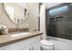 Bathroom with tub, toilet and updated vanity at 52320 W Foothill Trl, Maricopa, AZ 85139