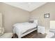 Bedroom with single bed, nightstand and ceiling fan at 52320 W Foothill Trl, Maricopa, AZ 85139
