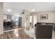 Open floor plan kitchen and living area with hardwood flooring at 52320 W Foothill Trl, Maricopa, AZ 85139
