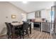 Modern kitchen with stainless steel appliances and breakfast bar at 52320 W Foothill Trl, Maricopa, AZ 85139