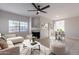 Open living room and dining area with modern decor and fireplace at 930 N Mesa Dr # 1039, Mesa, AZ 85201