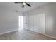 Bright bedroom with ceiling fan and sliding door closet at 930 N Mesa Dr # 1039, Mesa, AZ 85201