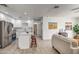 Modern kitchen with white cabinets, island, and stainless steel appliances at 3135 N 34Th St, Phoenix, AZ 85018